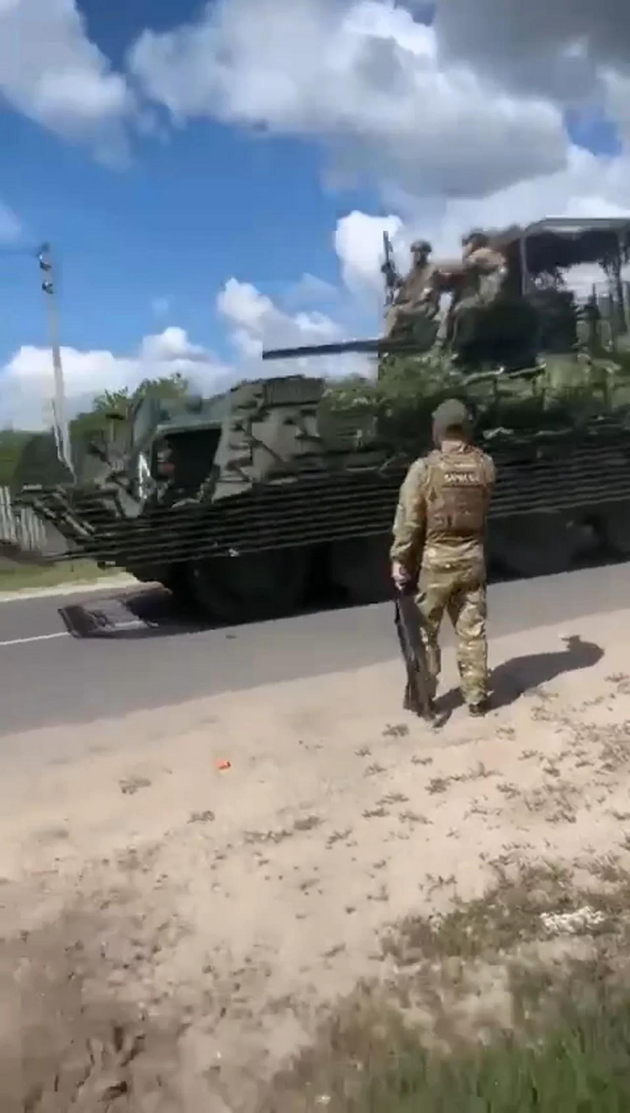 Soldiers of the Akhmat special forces show an APC captured from ...