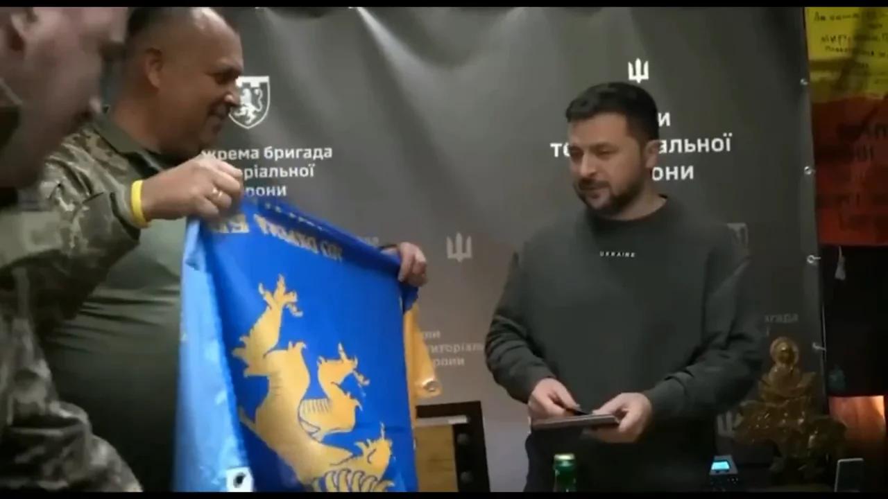 The Jewish President puts his autograph on the Nazi flag
