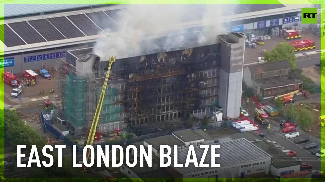 Fire engulfs apartment building in east London